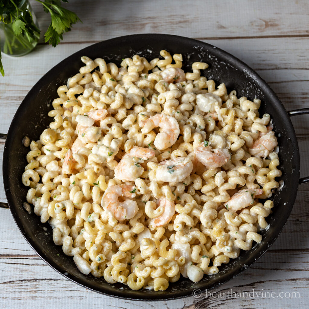 Large pan of seafood alfredo pasta.