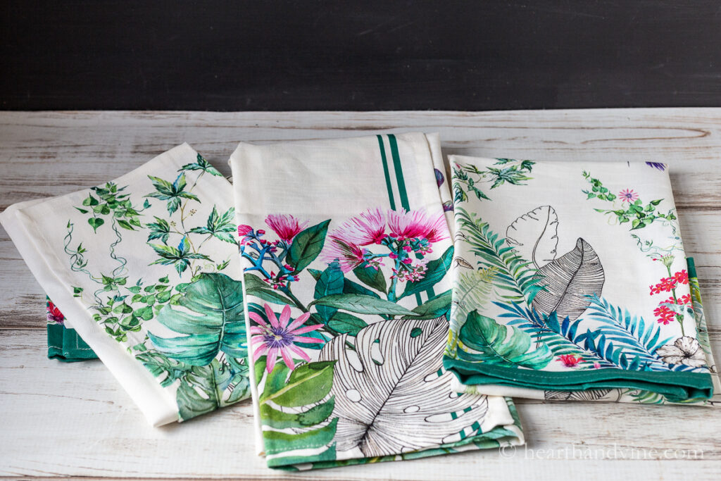 Set of three tropical printed tea towels.