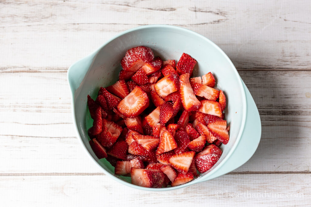 Bowl of sliced fresh strawberries.