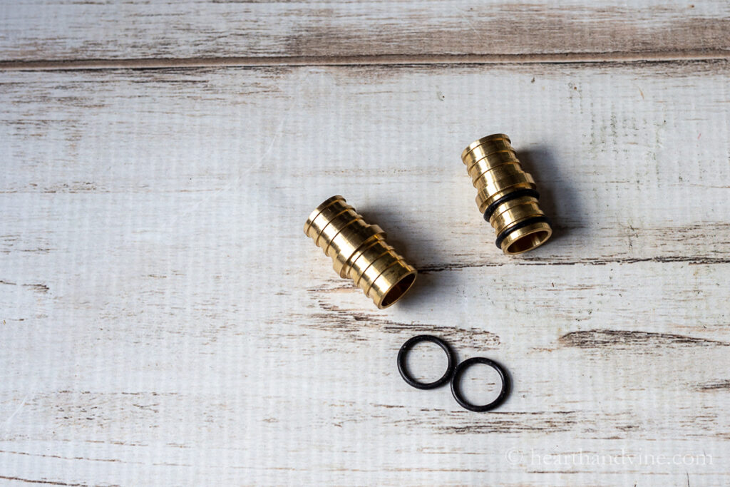 To brass wick holders with two rubber gaskets each.