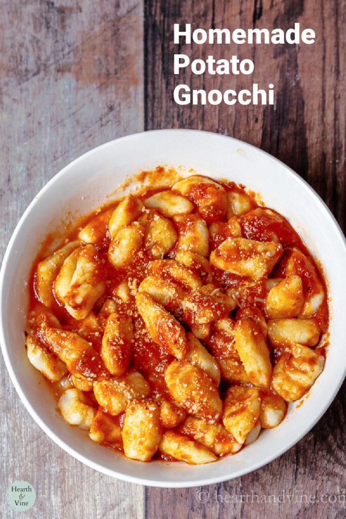 Bowl of homemade gnocchi in red sauce.