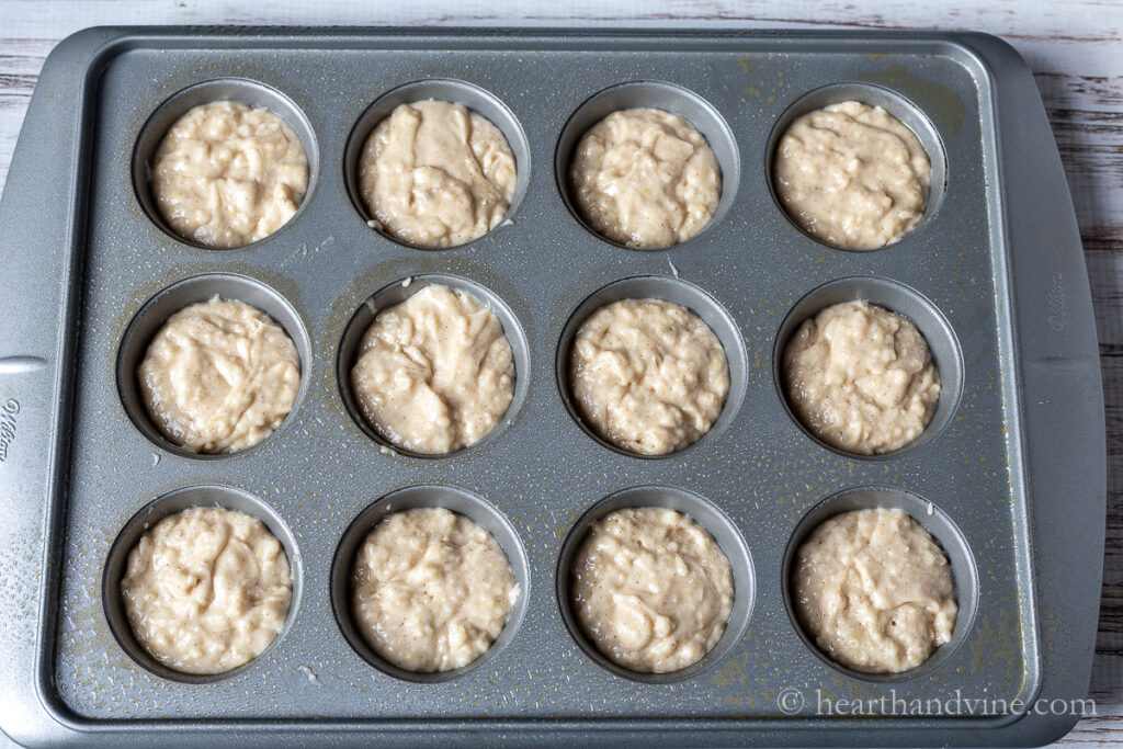 Muffing batter in muffin pan.