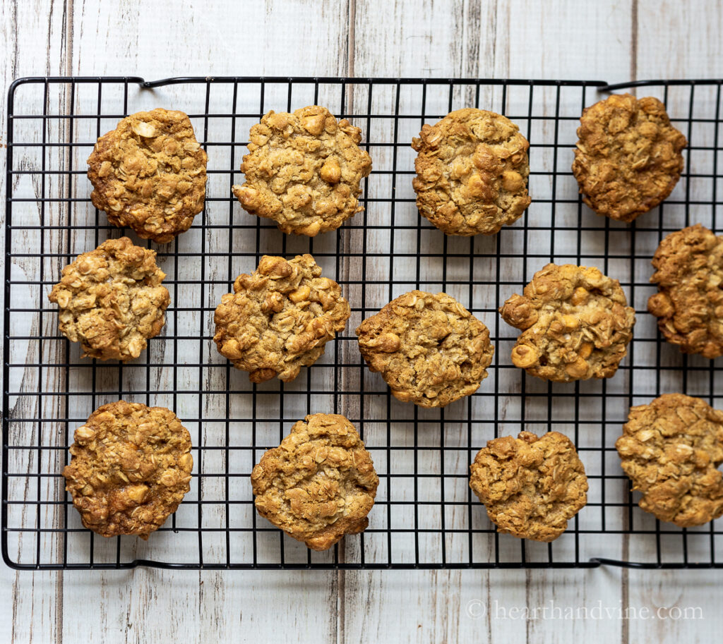 Oatmeal butterscotch cookies on a cooking rack.