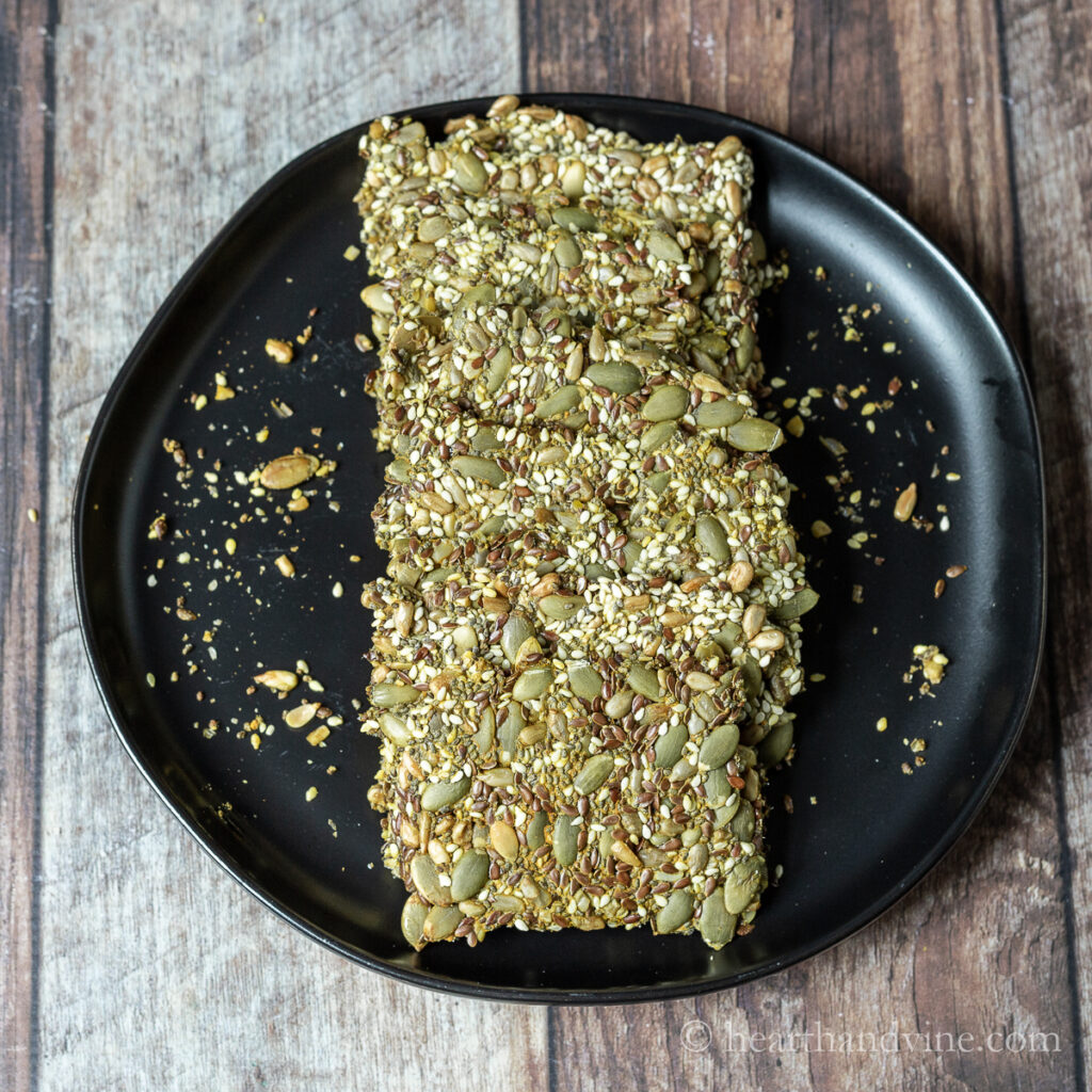 Black plate with multi seed crackers.