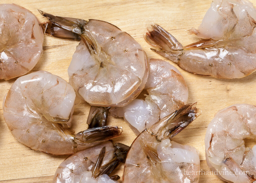 Raw shrimp with shells on.