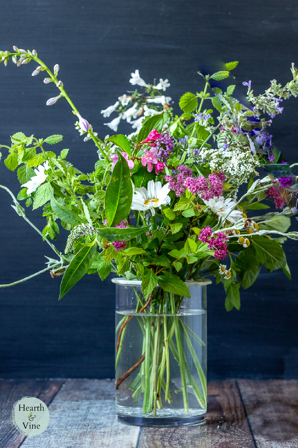 Mixed floral arrangement with clay flower frog.