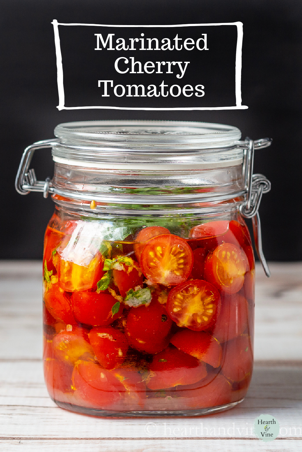 Large air-tight jar of marinated tomatoes.