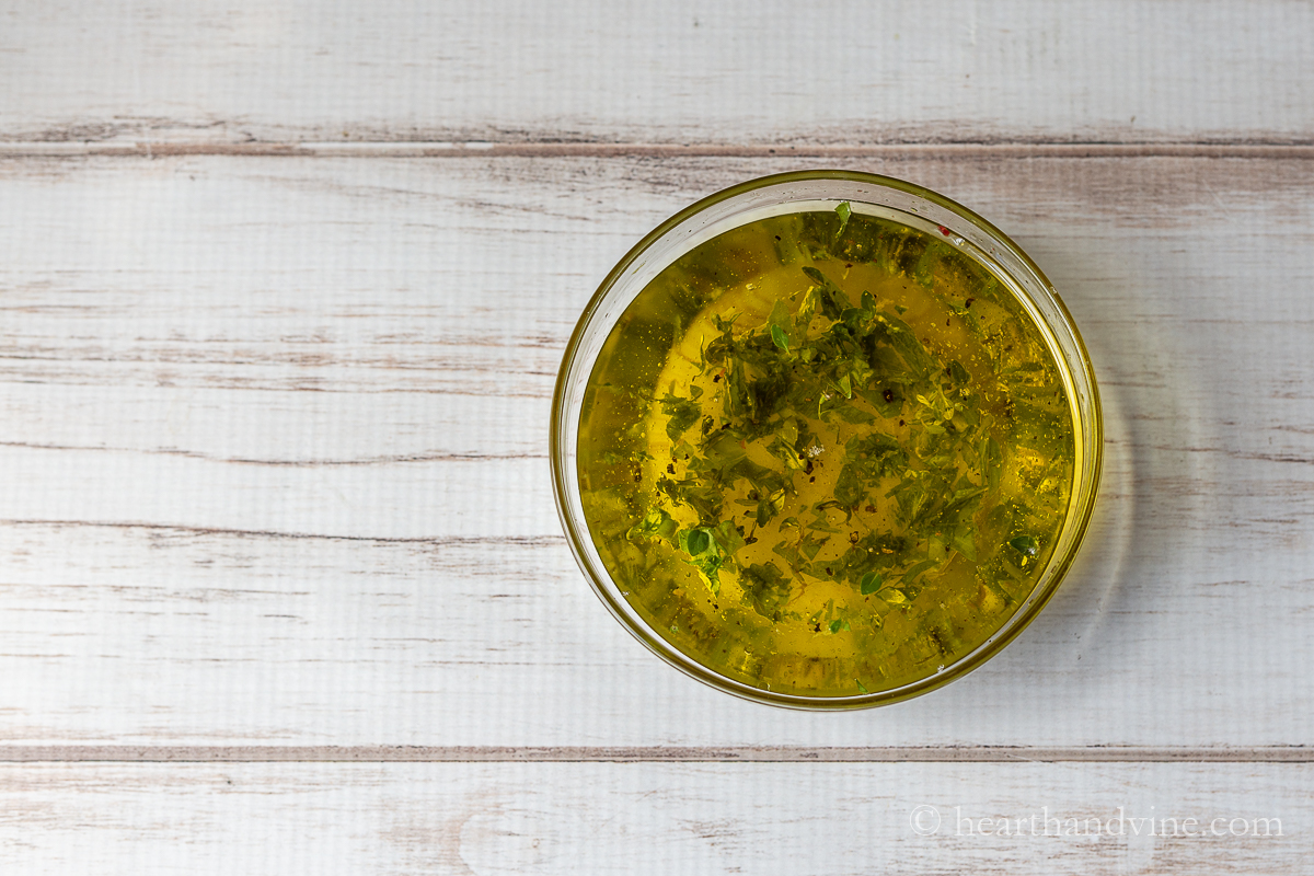 Oil and herb mixture for marinating tomatoes.