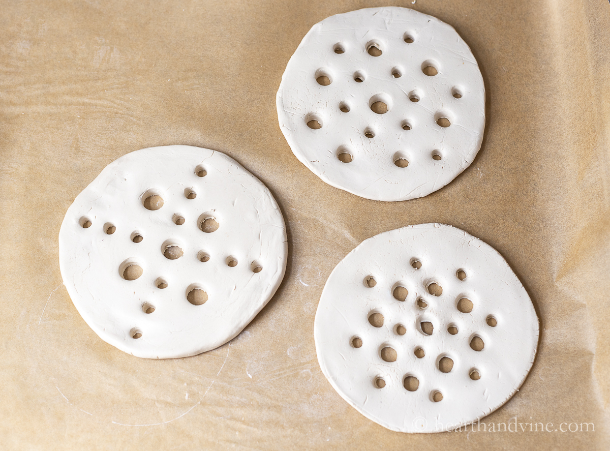 Three air dry clay flower frogs.