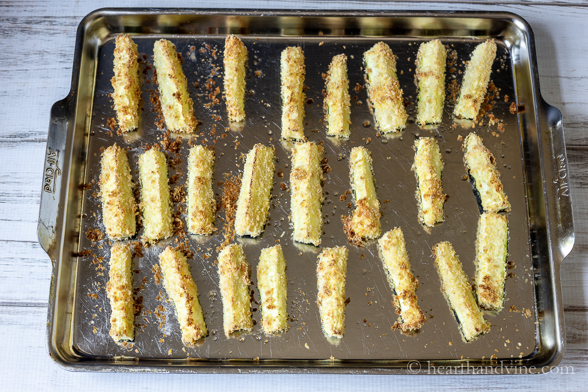 Zucchini fries on a baking sheet straight from the oven.