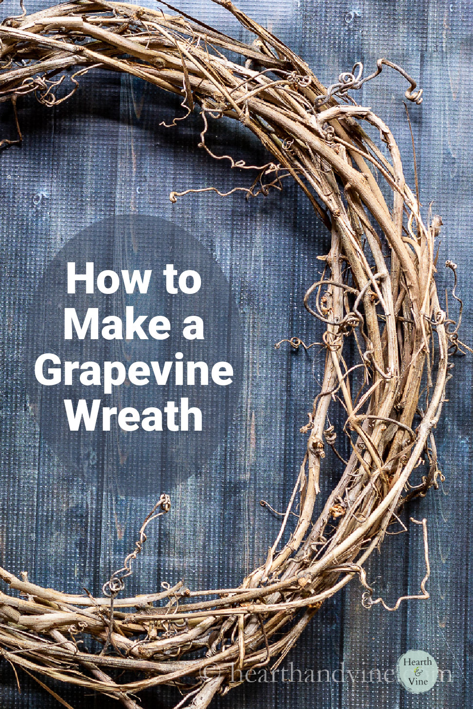 Partial view of a homemade grapevine wreath.