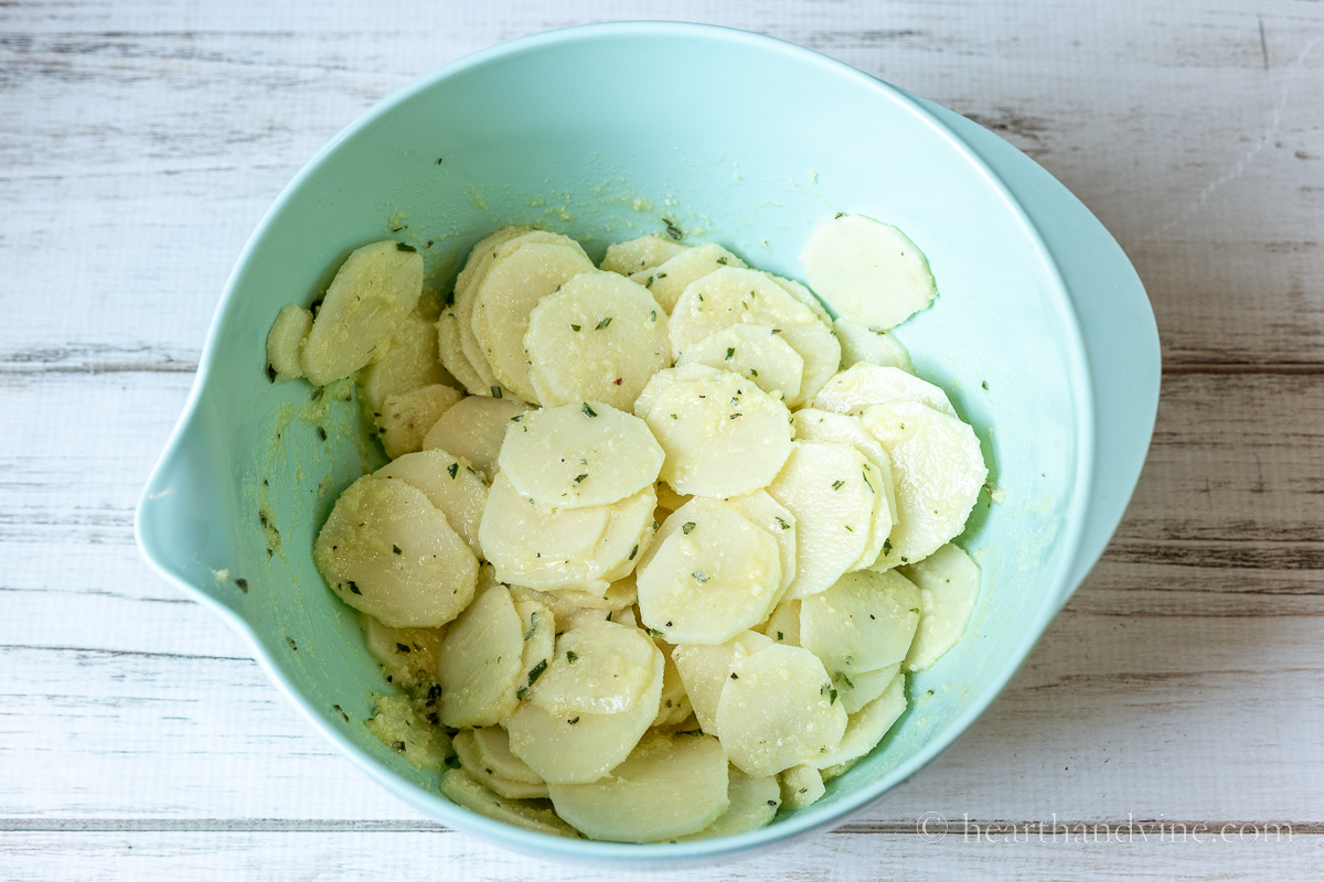 Thinly sliced potatoes tossed in a butter, oil, and spice mixture.
