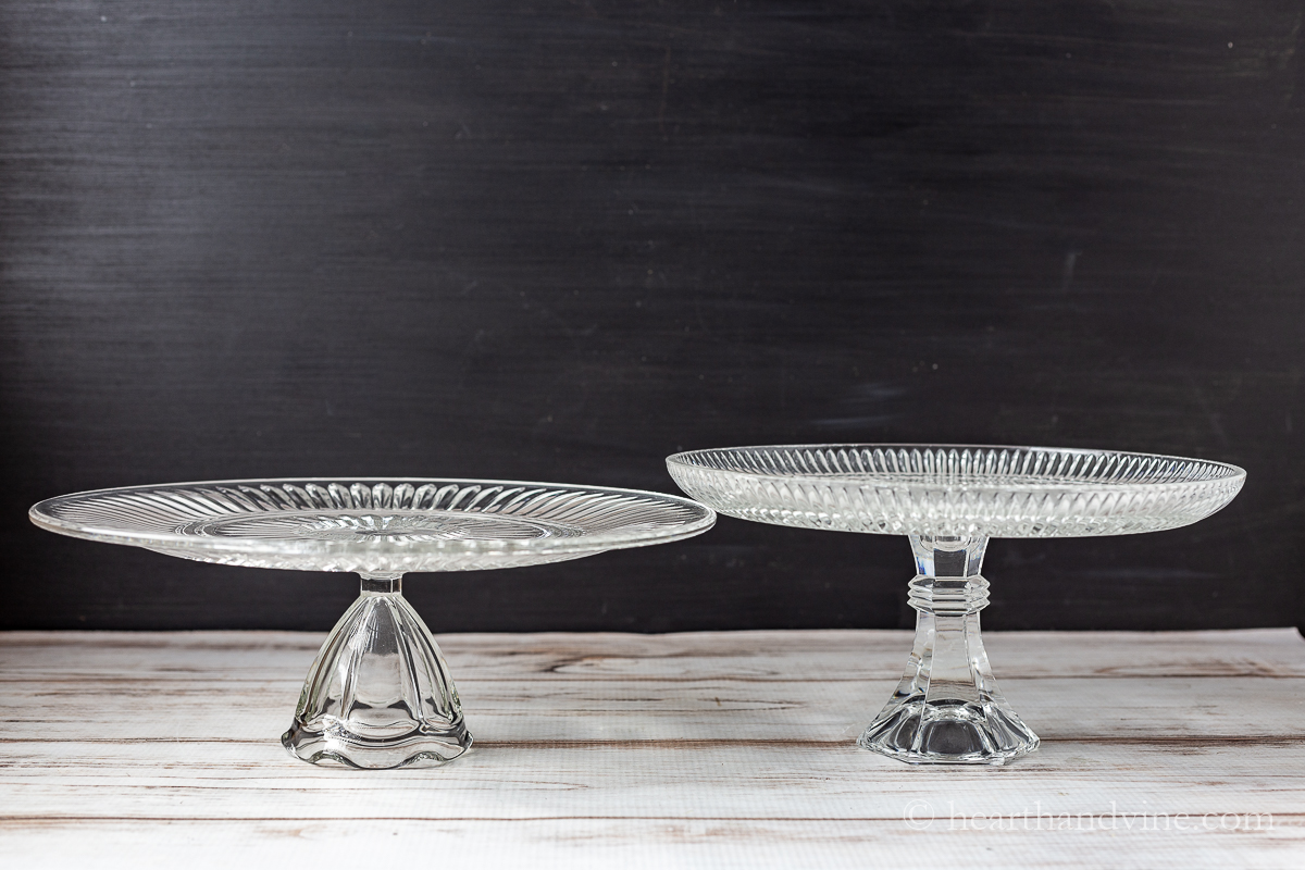 Two handmade upcycled clear glass cake stands.