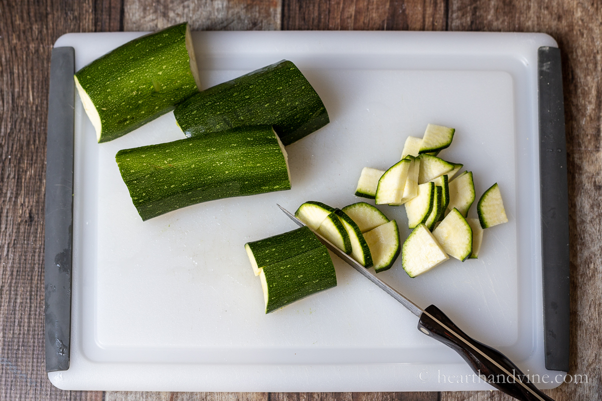 Thin slices of quartered zucchini.