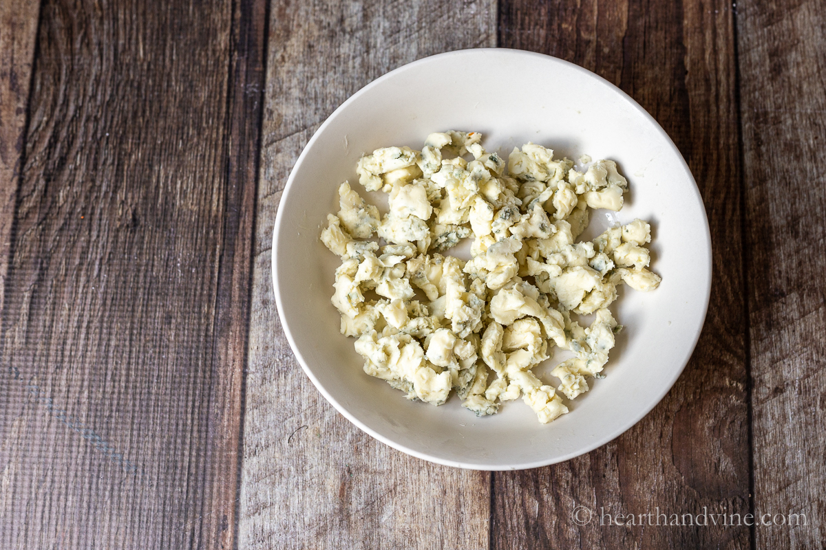 Gorgonzola cheese broken up into crumbles.