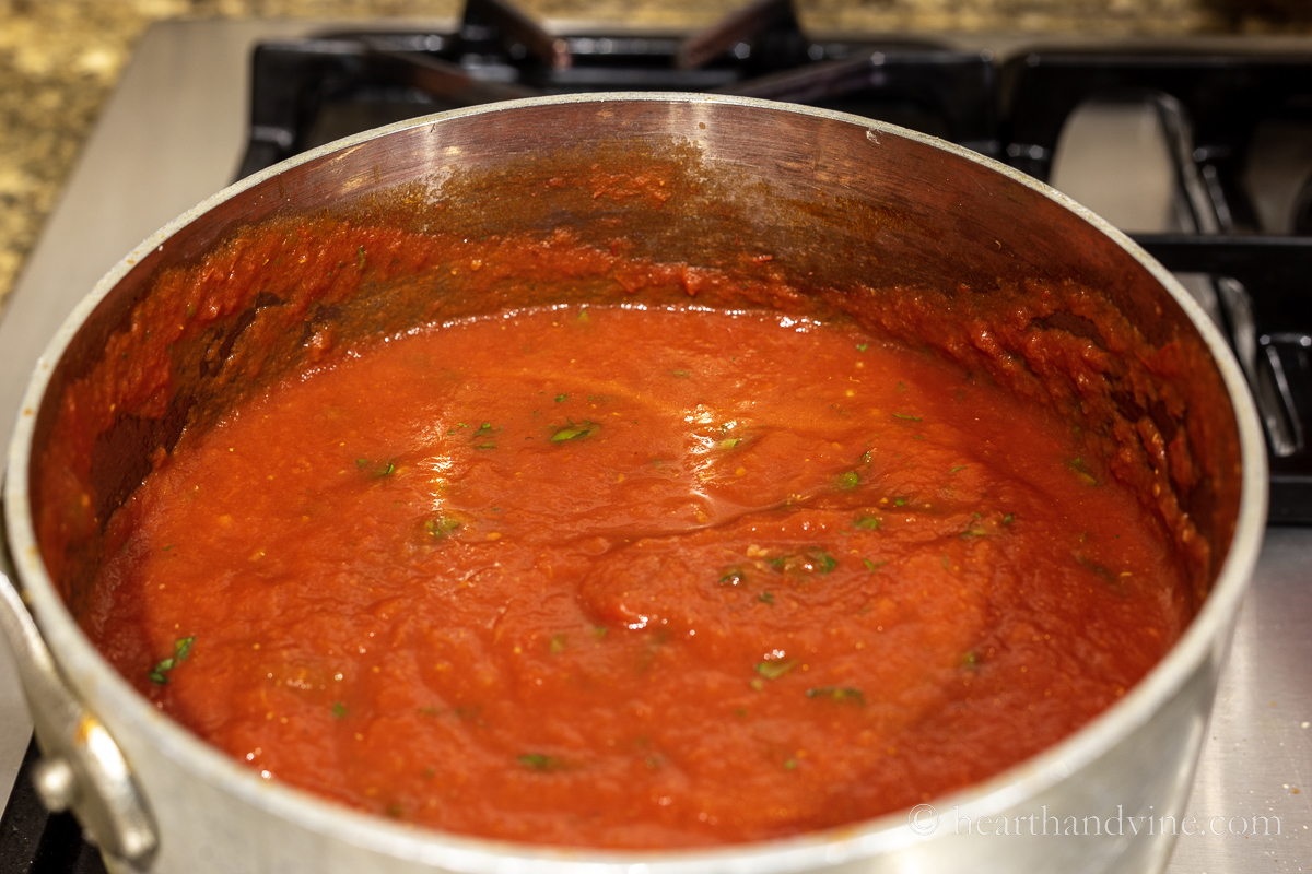 Marinara sauce in a saucepan on the stove.