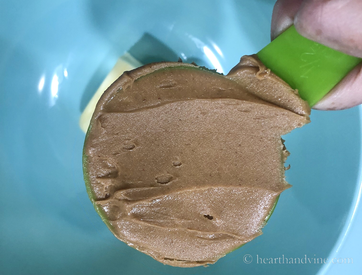 Creamy peanut butter in a measuring cup.