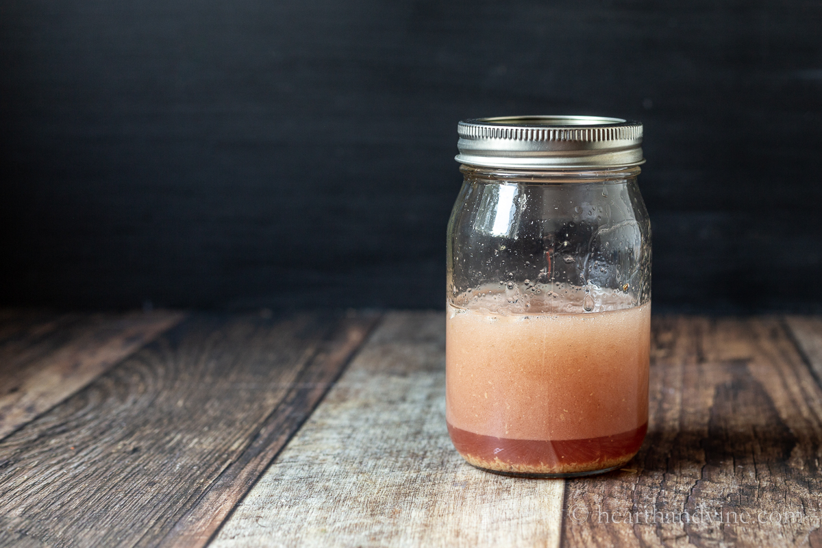 Raspberry vinaigrette in a mason jar.