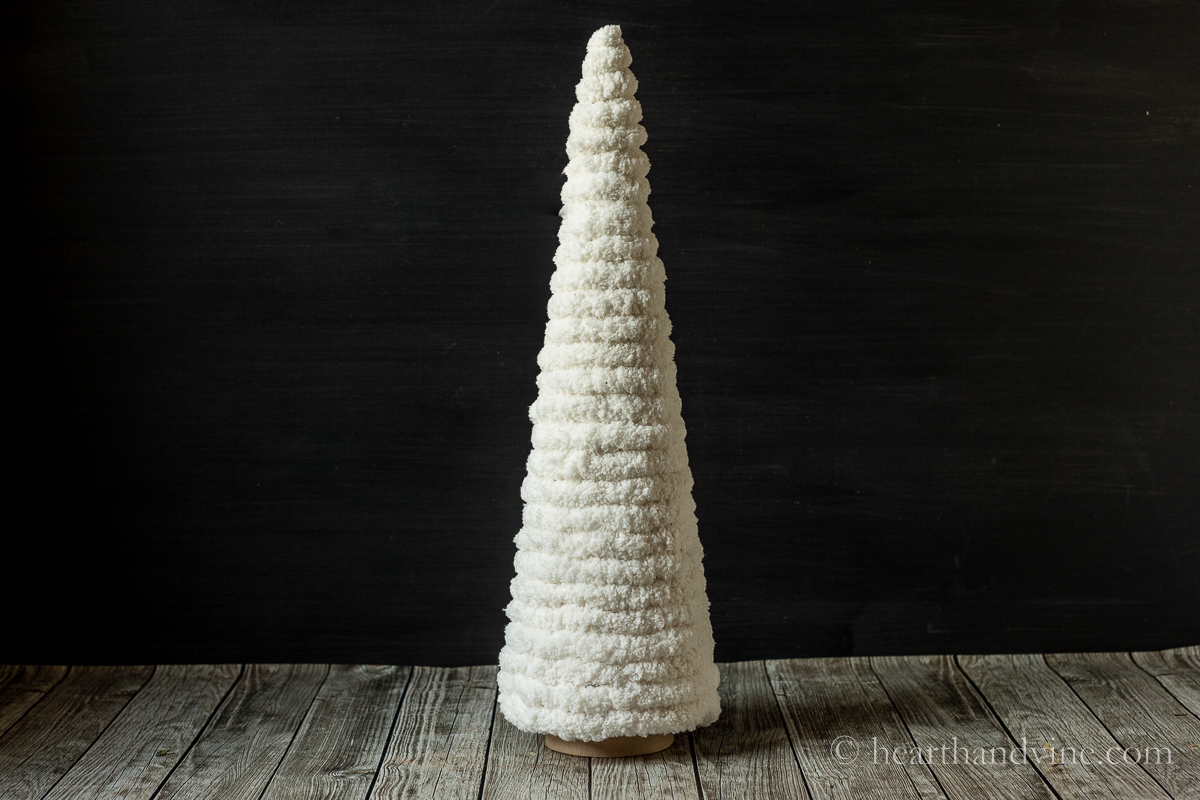 Yarn tree made from paper mache cone and jumbo off white yarn.