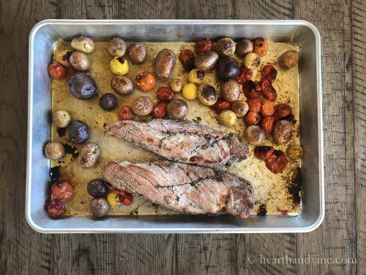 Oven baked pork tenderloin, tomatoes and potatoes from the oven.