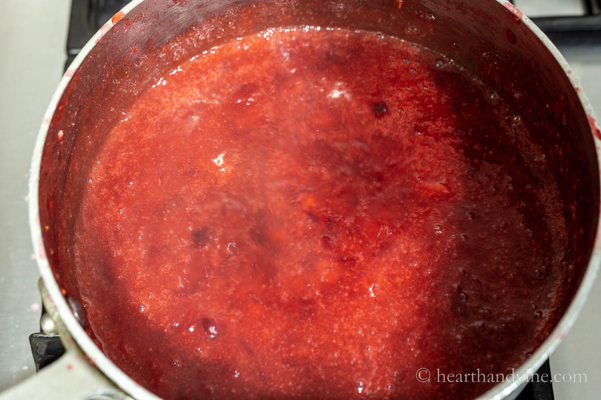 A saucepan with smooth cranberry jam.