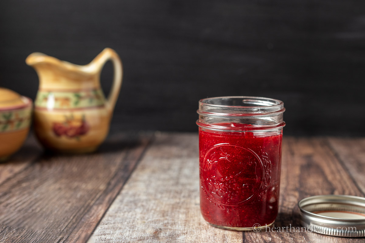 Half pint mason jar filled with jam.