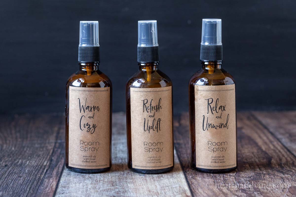 Three room spray amber glass bottles with brown kraft paper labels.