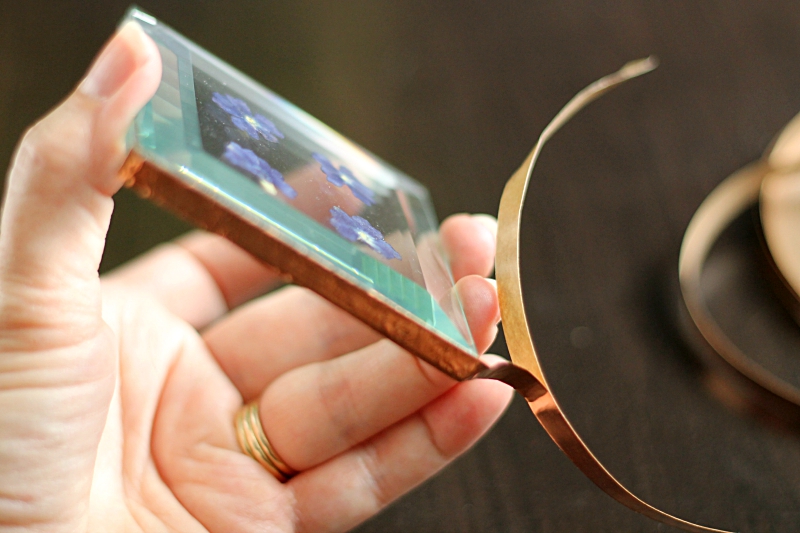 Copper foil tape on two glass bevel edges.