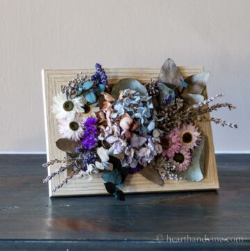 Dried flower art frame on a table.