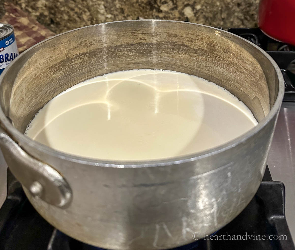 Heating evaporated milk on the stove.