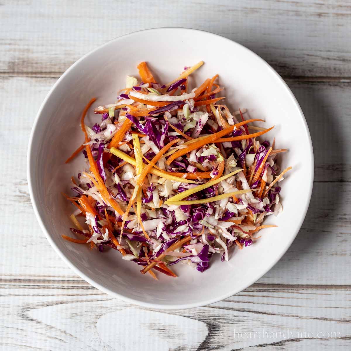 Rainbow slaw in a white bowl.