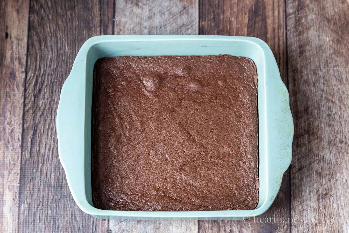 Baked brown sugar brownies in square blue baking pan.