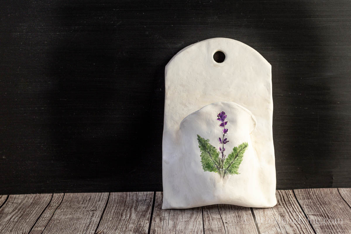 DIY will pocket out of clay with fern and lavender embellishment.