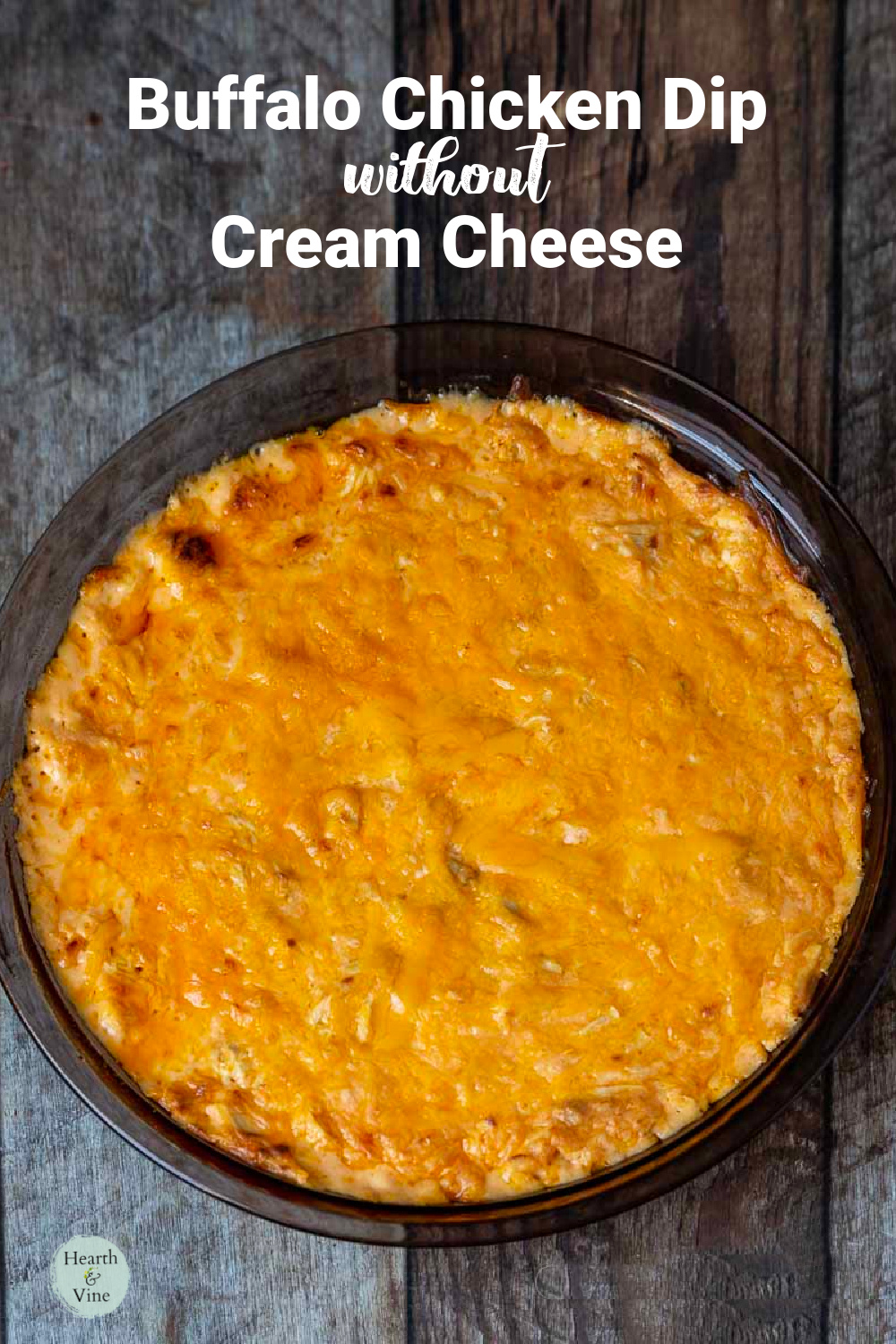 A pie pan with buffalo chicken dip baked until golden.