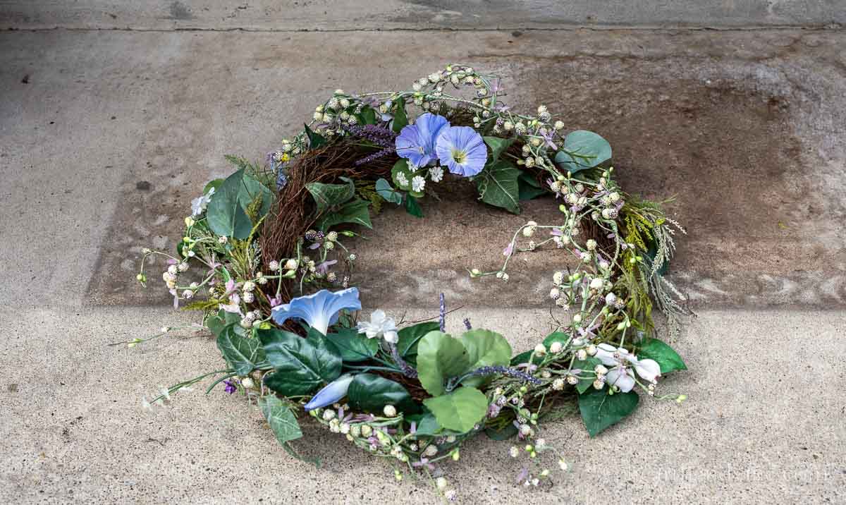 Spring floral garland shaped into a circle to create a wreath.
