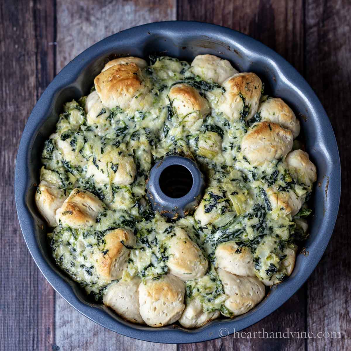 Spinach artichoke pull apart bread in a bundt pan.