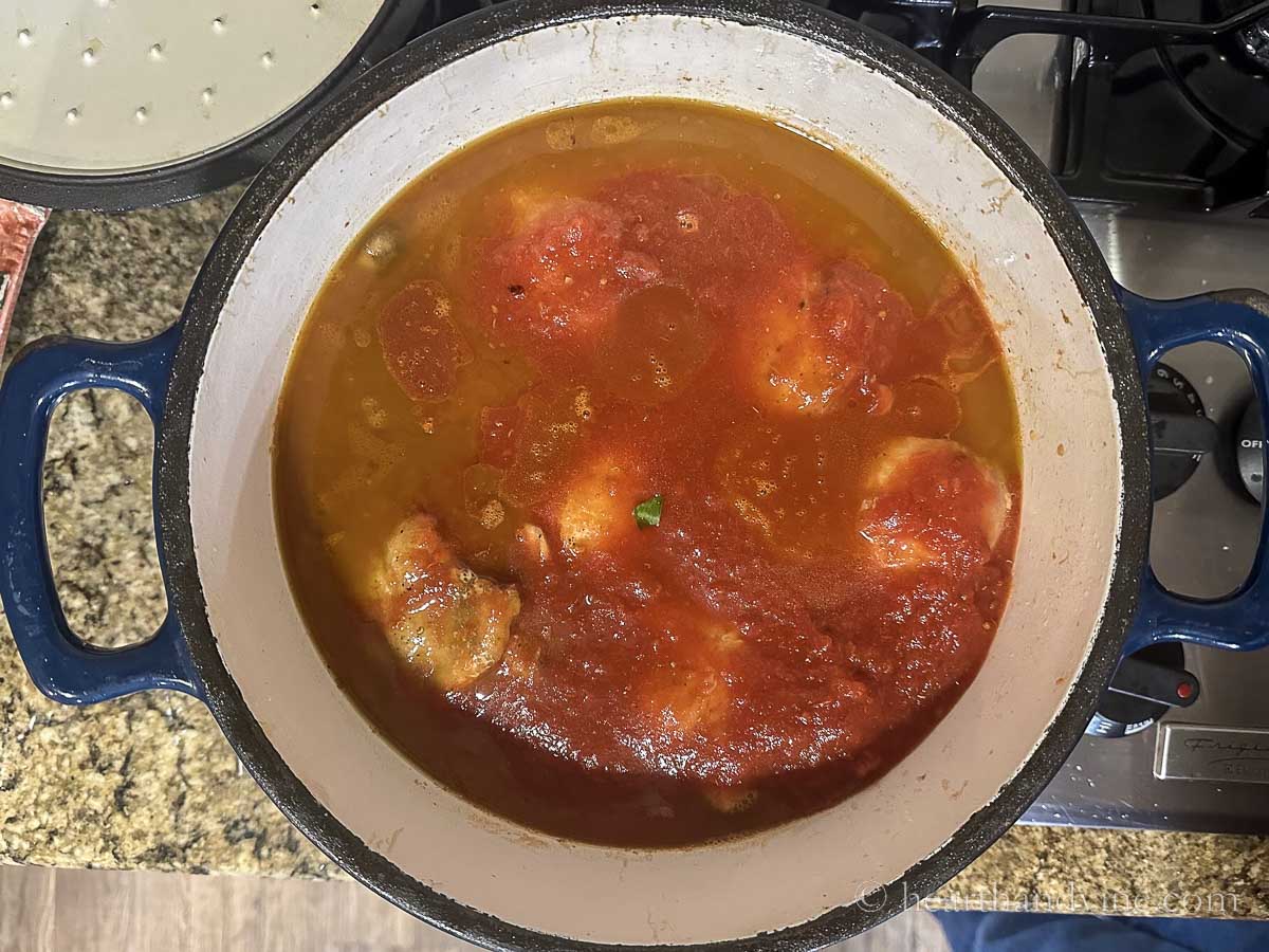 Dutch oven chicken cacciatore simmering.