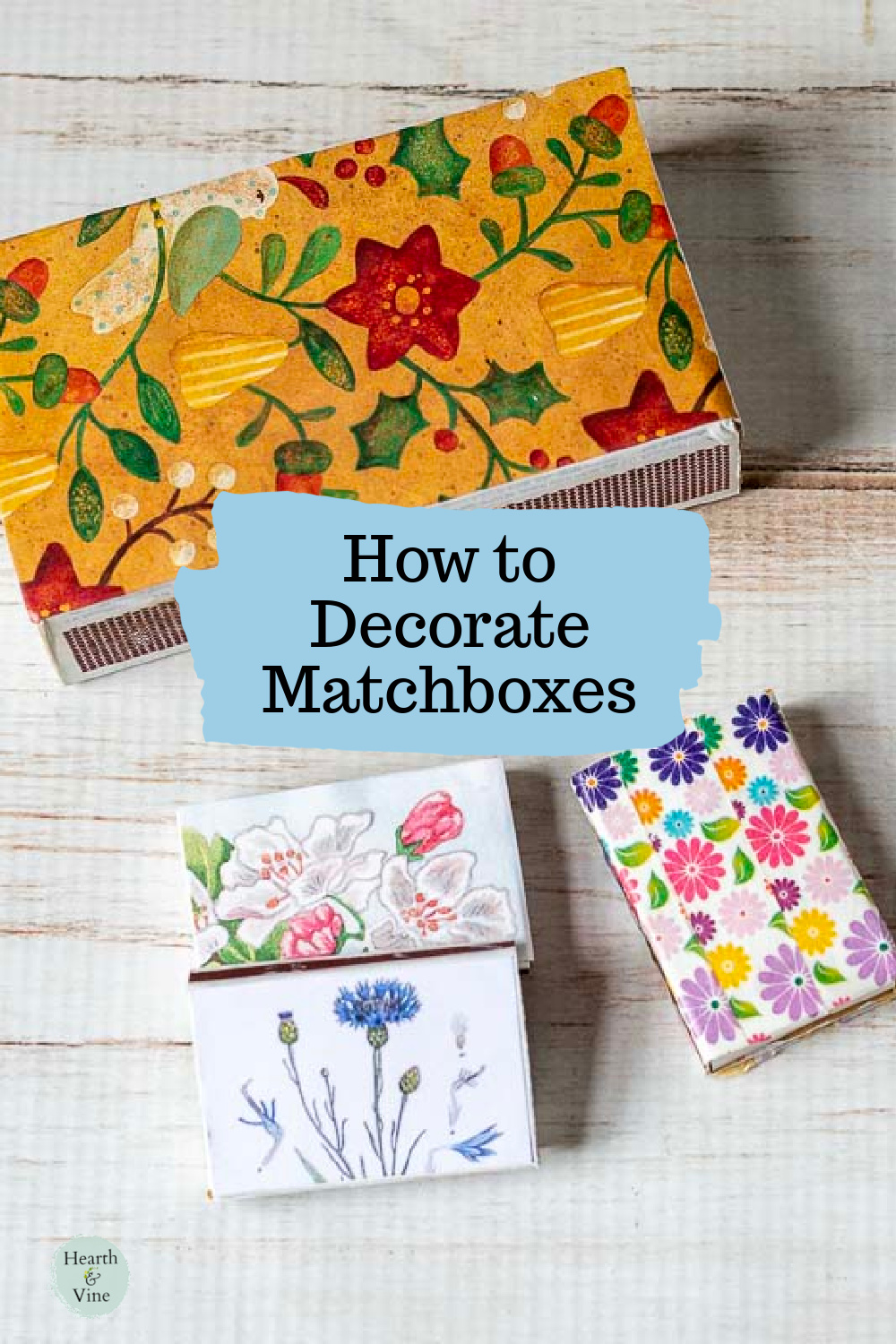 Three small decorative matchboxes with floral prints and a large matchbox with a country print.