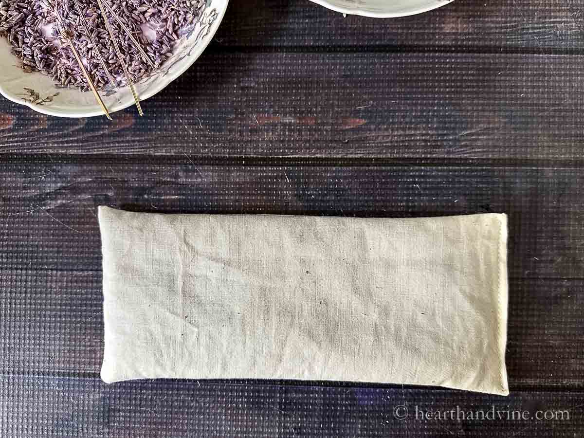 A muslin filled pillow with lavender and flaxseed filling.
