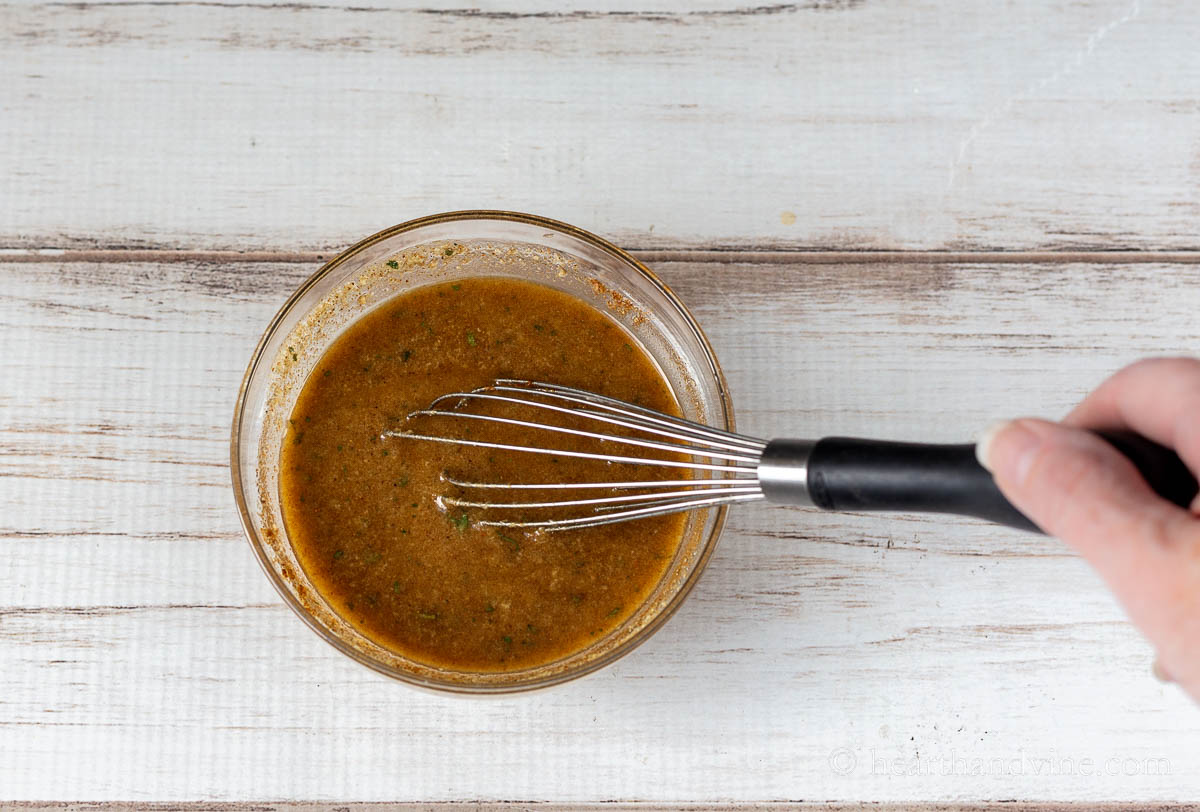 Whisk in a bowl of spicy seasoned oil.