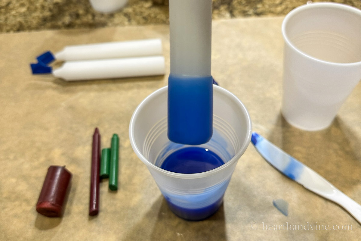 White candle dipped in to blue wax on the end.
