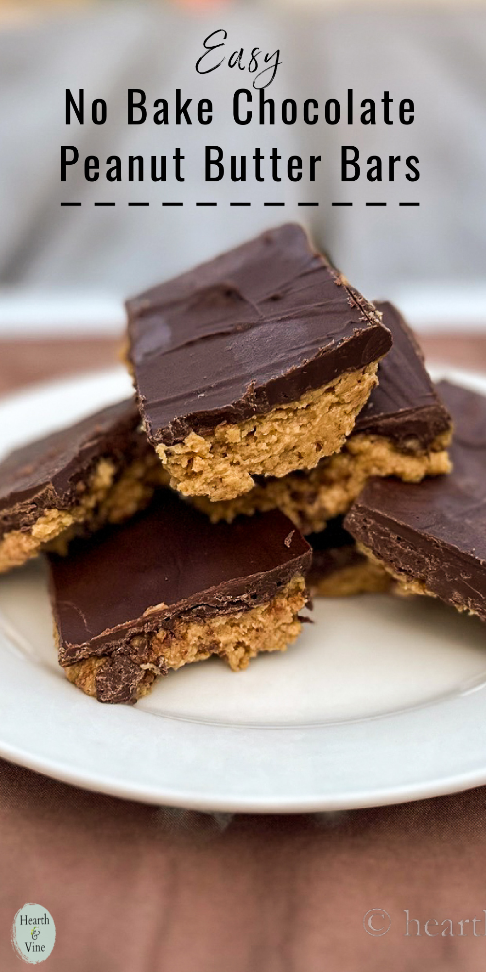 A plate of stacked chocolate peanut butter bars.