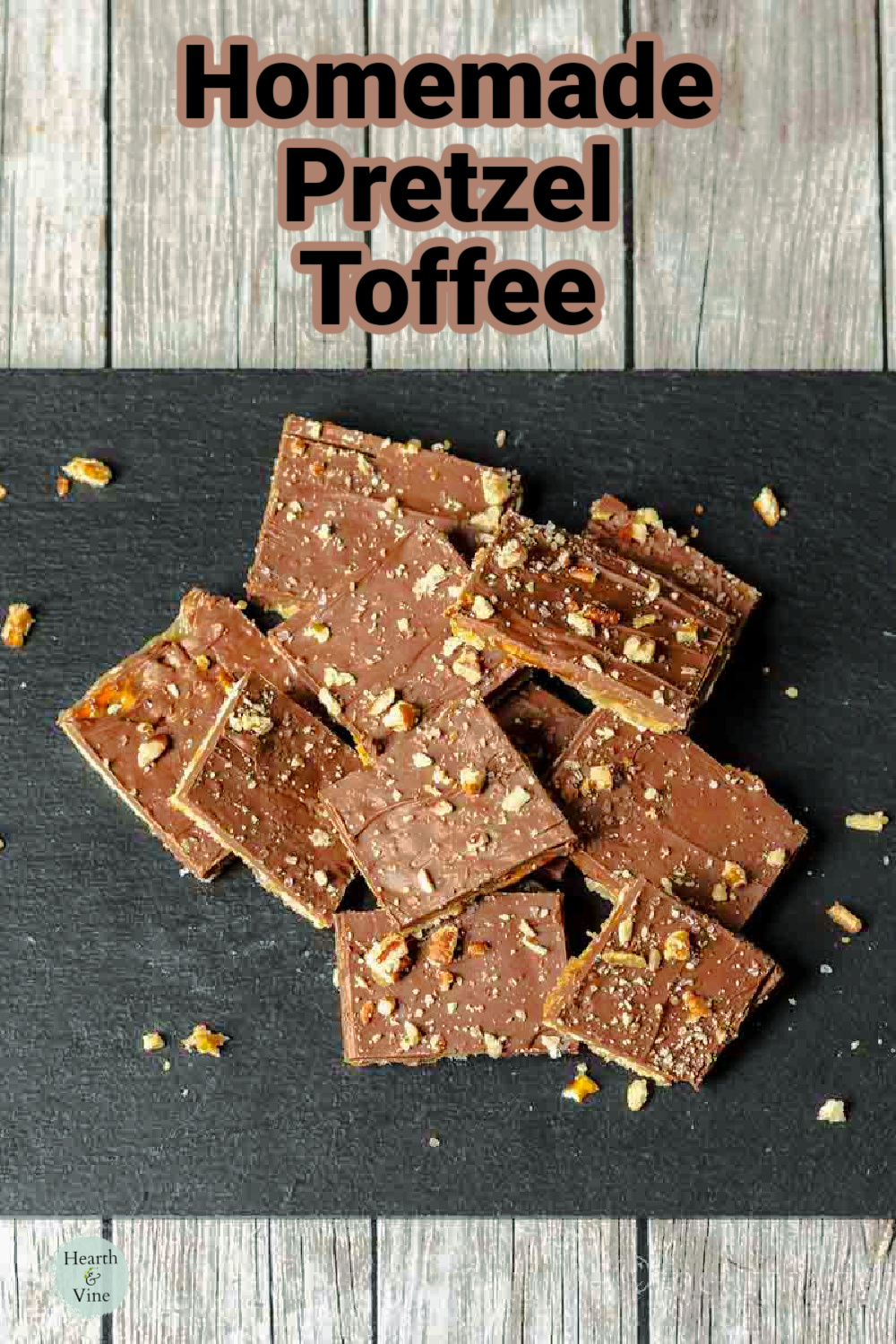 Pretzel toffee pieces on a piece of black slate.