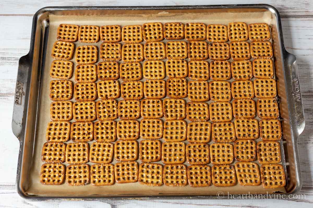 Square shaped mini pretzels on a baking pan.