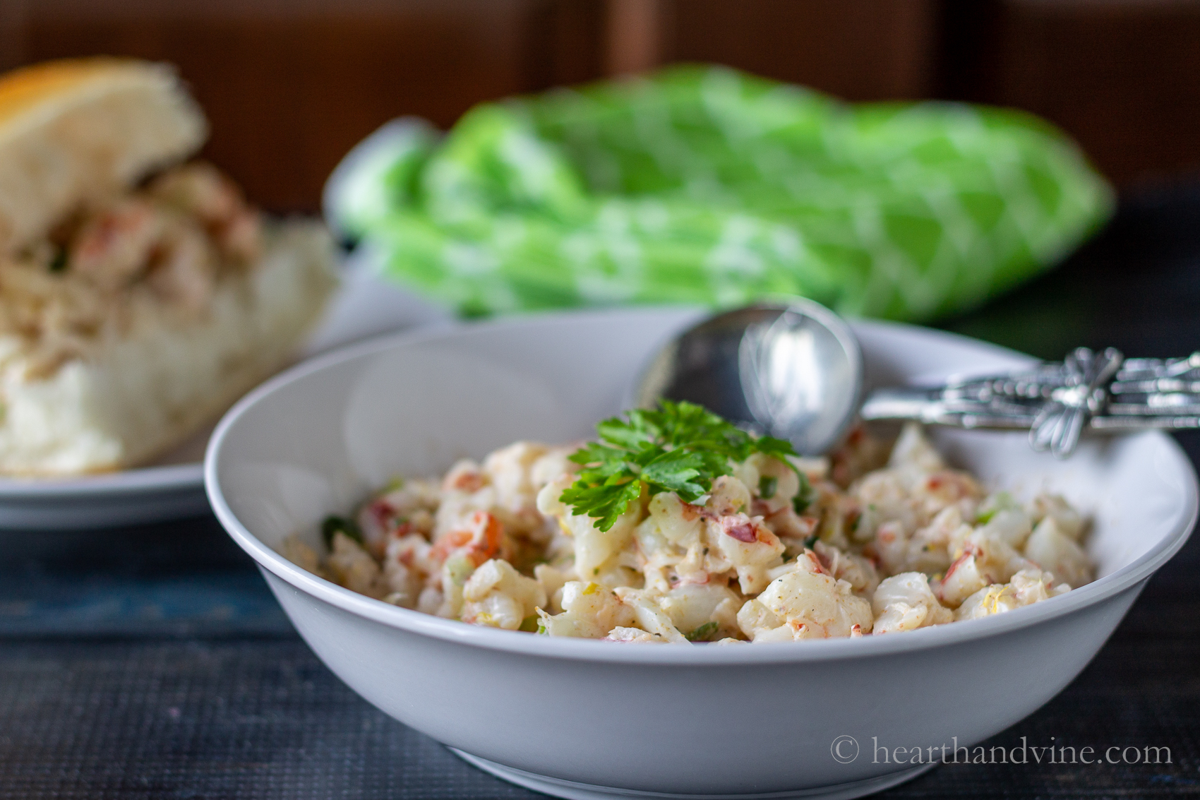 Shrimp salad in a white bowl.