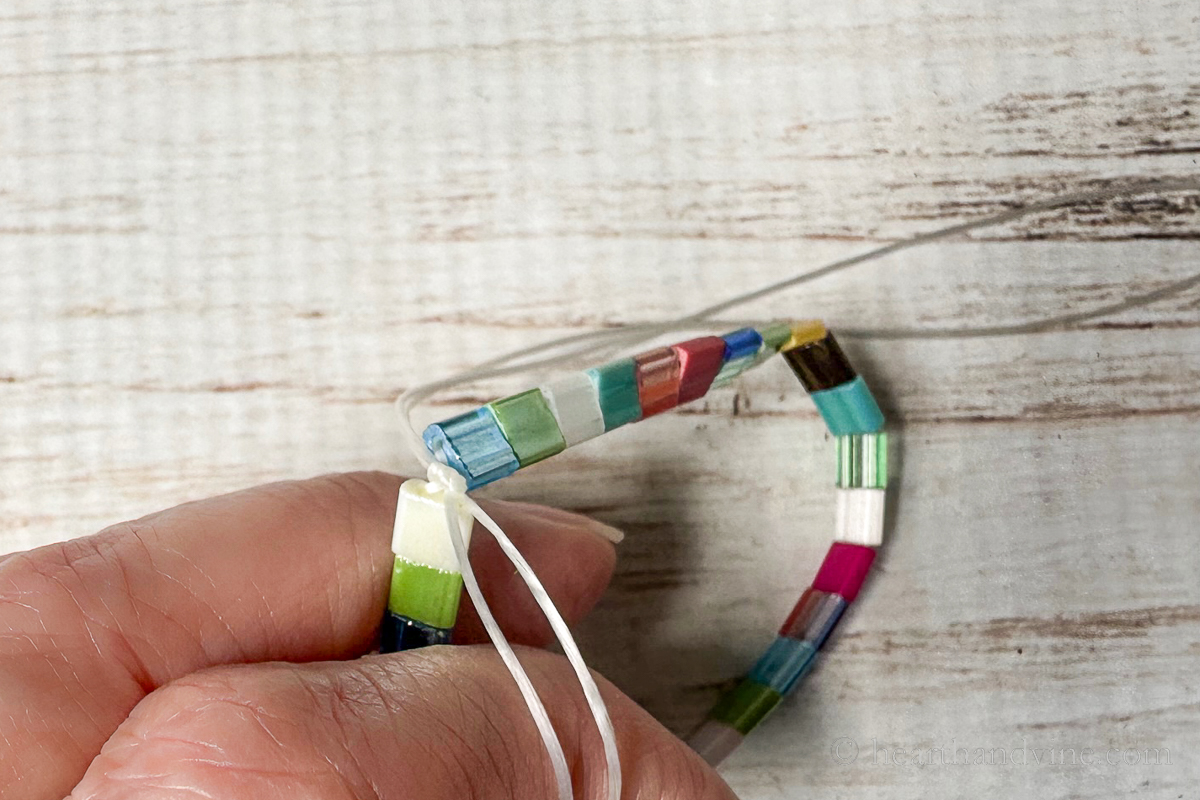 Tila bead stretchy bracelet end knot.