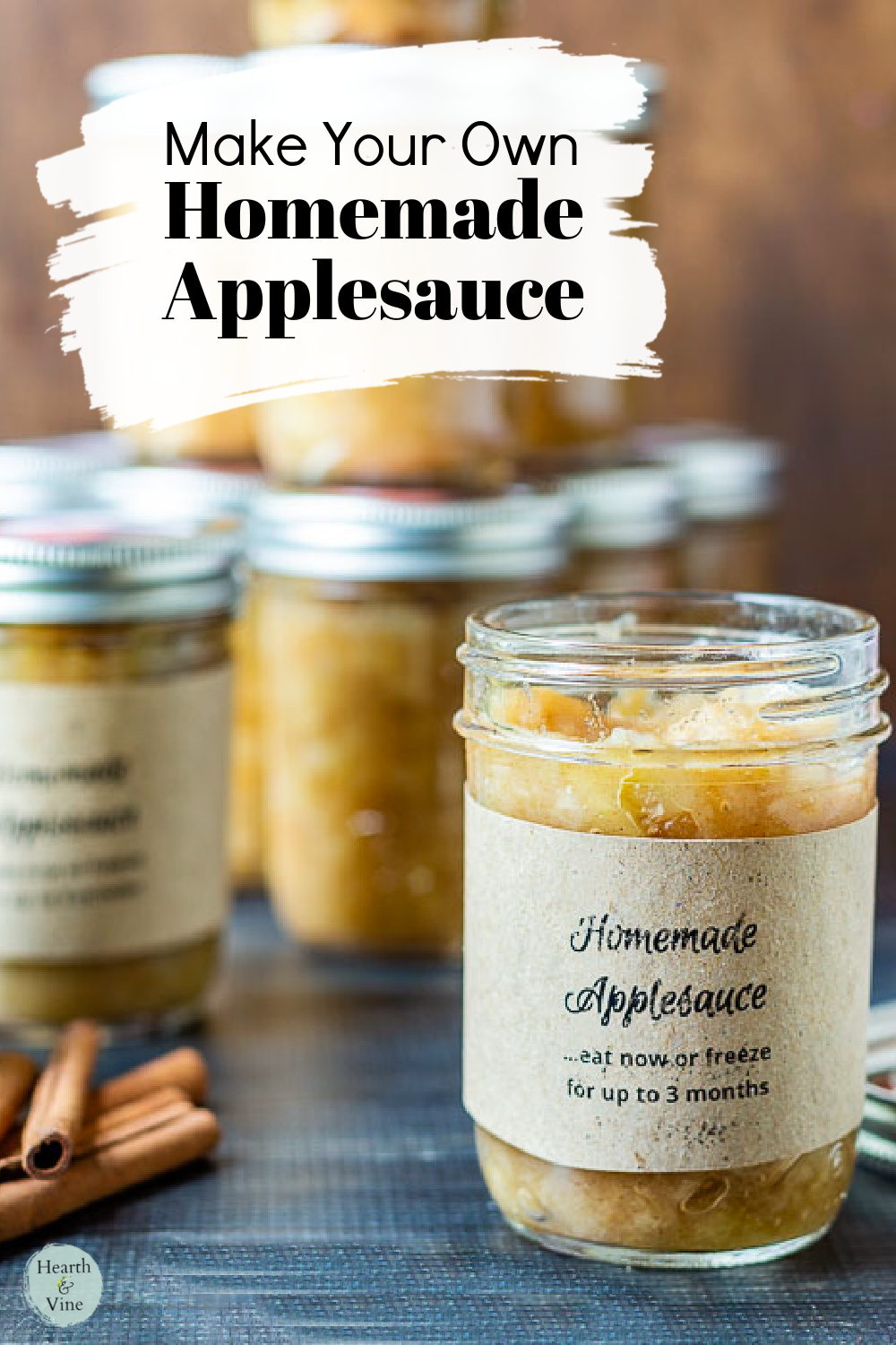 Pint mason jars filled with homemade applesauce with no sugar and handmade labels.