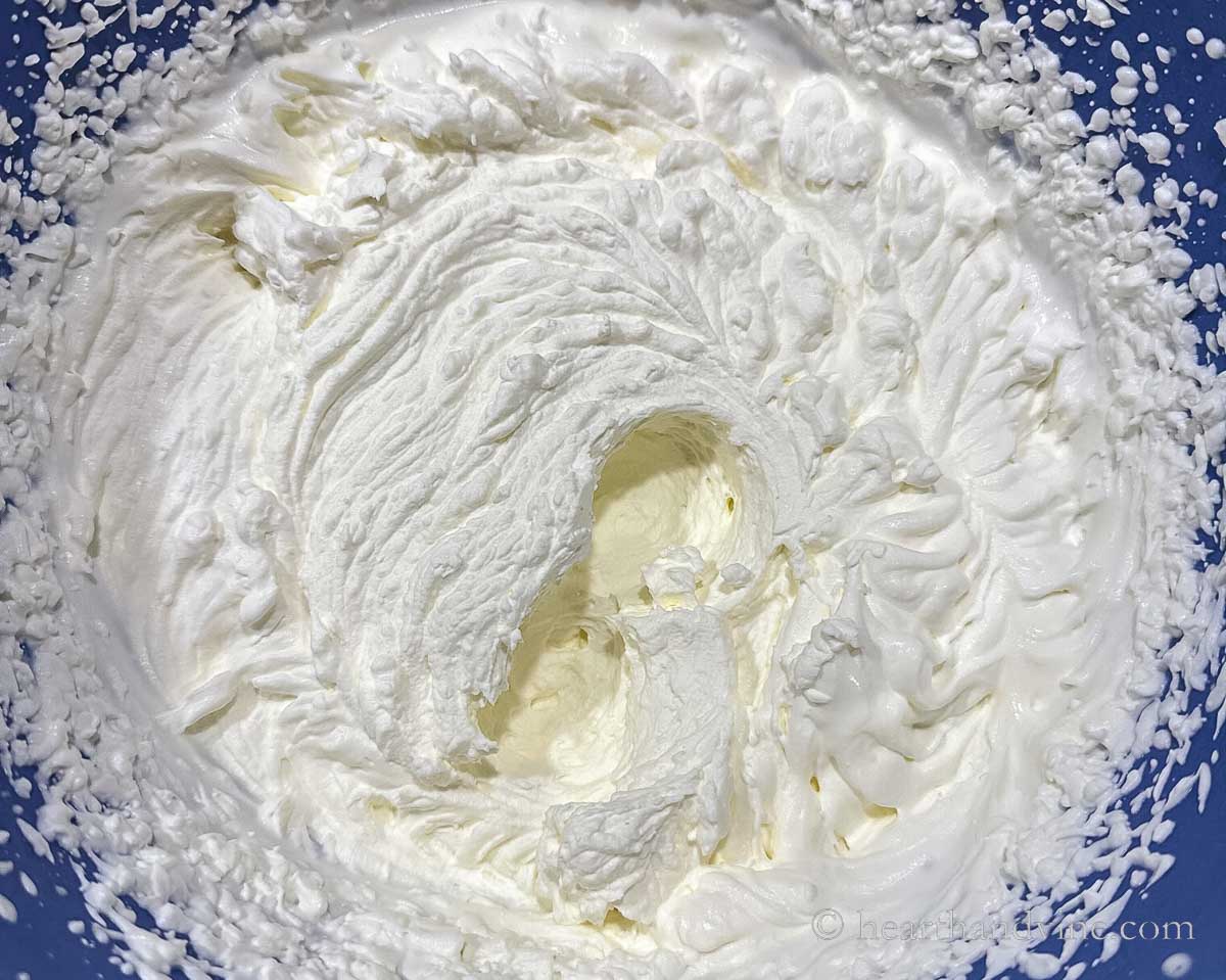 Whipped cream in a large blue bowl.