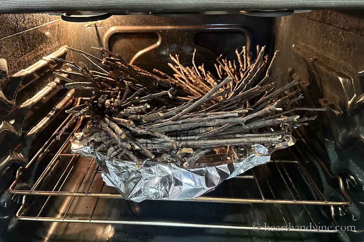 Twig wreath in the oven on foil and a pan.