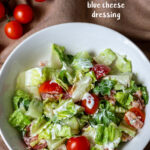 Serving of BLT salad with cherry tomatoes on the side.